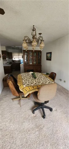 a kitchen with stainless steel appliances a stove refrigerator sink and cabinets
