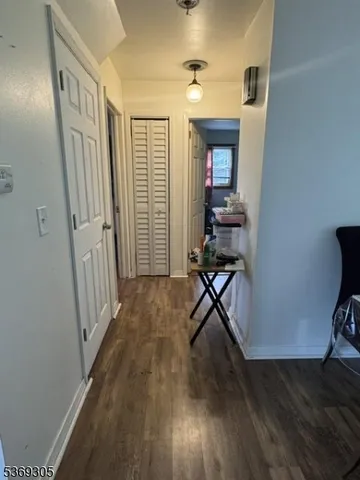 a view of a livingroom with furniture and a window