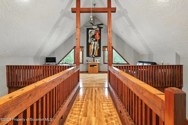 a living room with furniture rug and wooden floor
