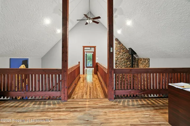 a kitchen with a refrigerator sink and black cabinets