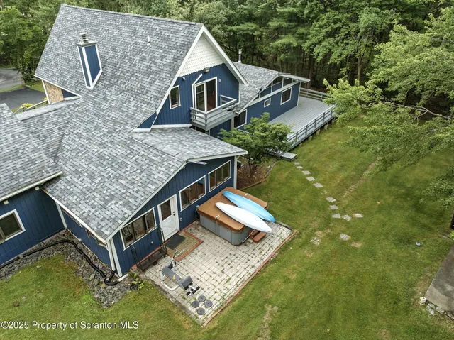 an aerial view of a house with swimming pool