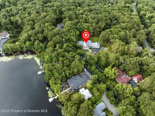 a kitchen with stainless steel appliances granite countertop a refrigerator and a stove