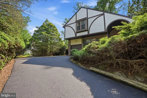 a house with trees in the background