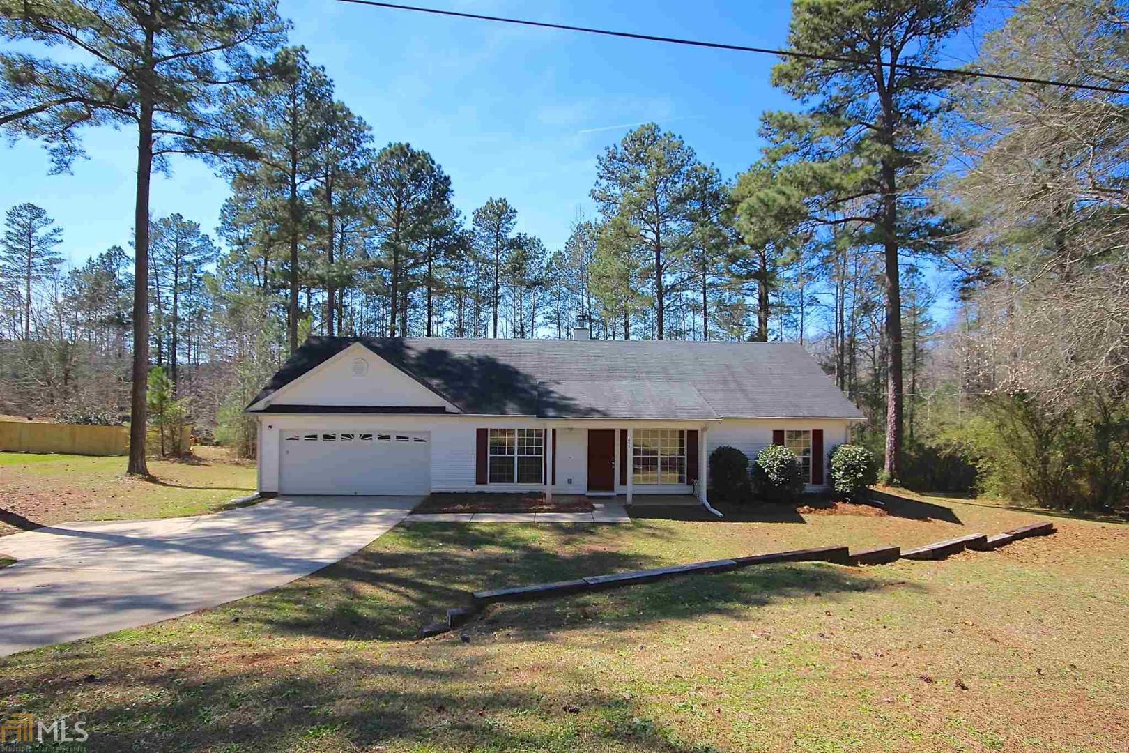 a front view of a house with swimming pool