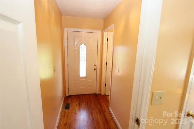 a view of a bathroom with wooden floor