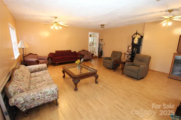 a living room with furniture and a lamp