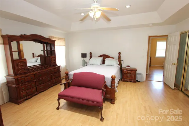 a bedroom with furniture and a dresser