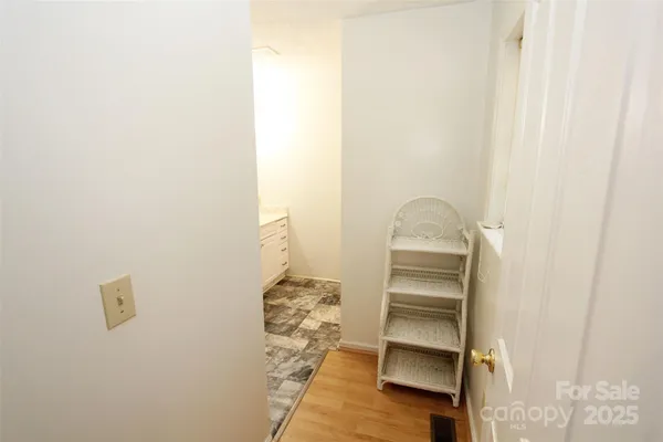 a view of walk in closet with empty racks