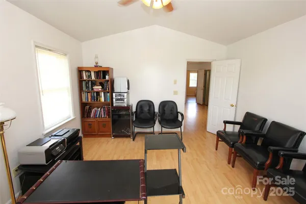 a view of a workspace with furniture and a couch