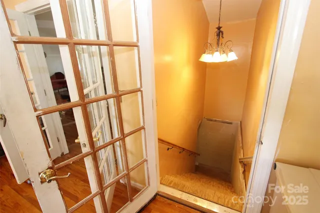a view of a hallway with a large mirror