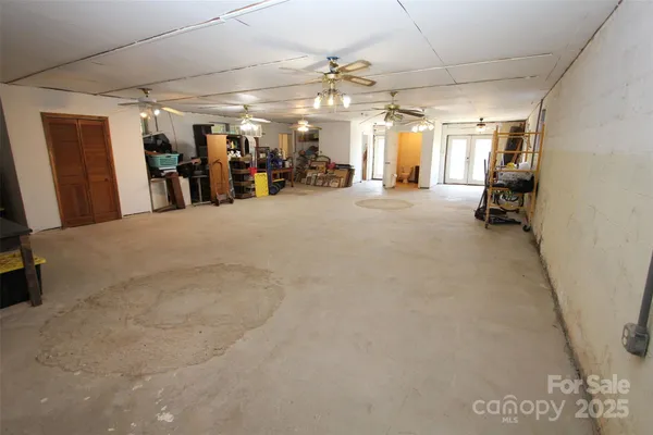 a kitchen with a sink refrigerator and stove