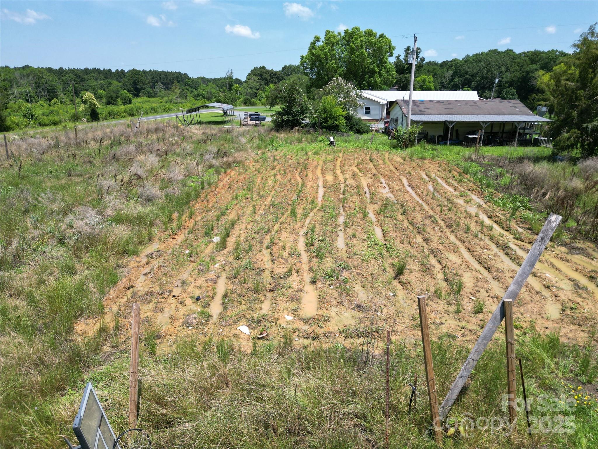 843 Upper White Store Road Peachland, NC 28133 - Photo 42 of 48 a view of a garden with a lake