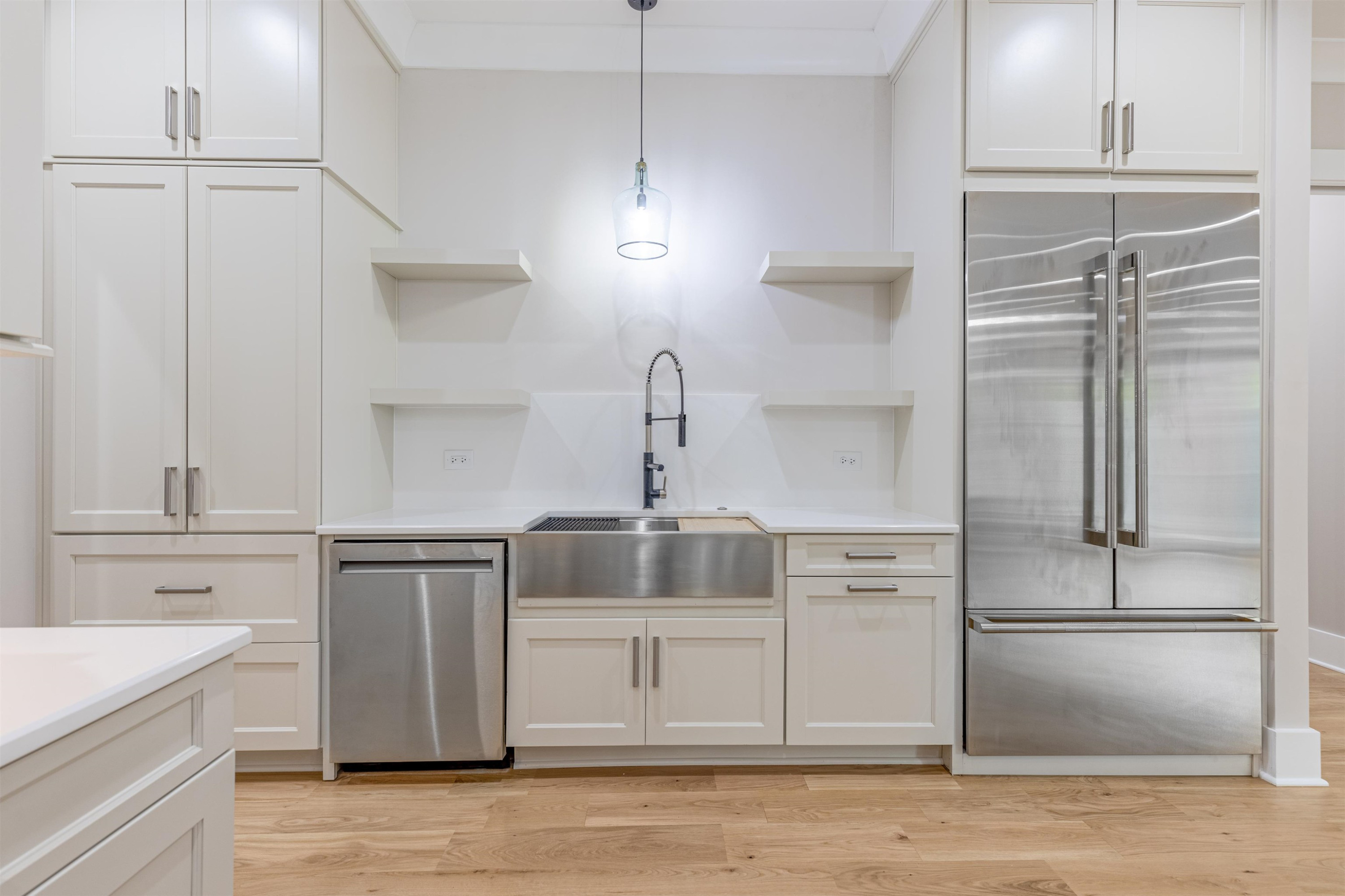 336 Waldo Street Cary, NC 27511 - Photo 18 of 62 a kitchen with a refrigerator sink and cabinets