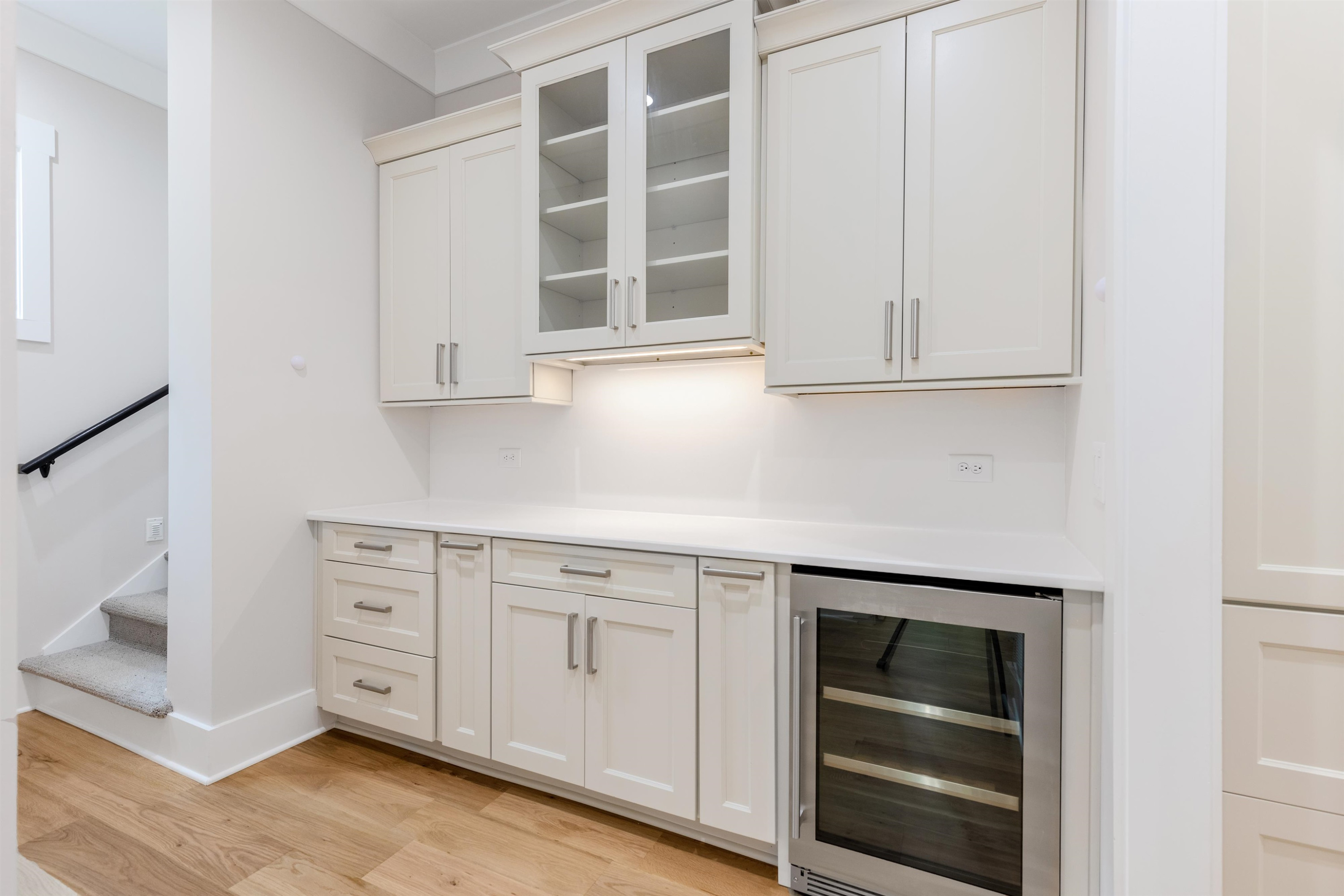 336 Waldo Street Cary, NC 27511 - Photo 19 of 62 a kitchen with white cabinets and a stove