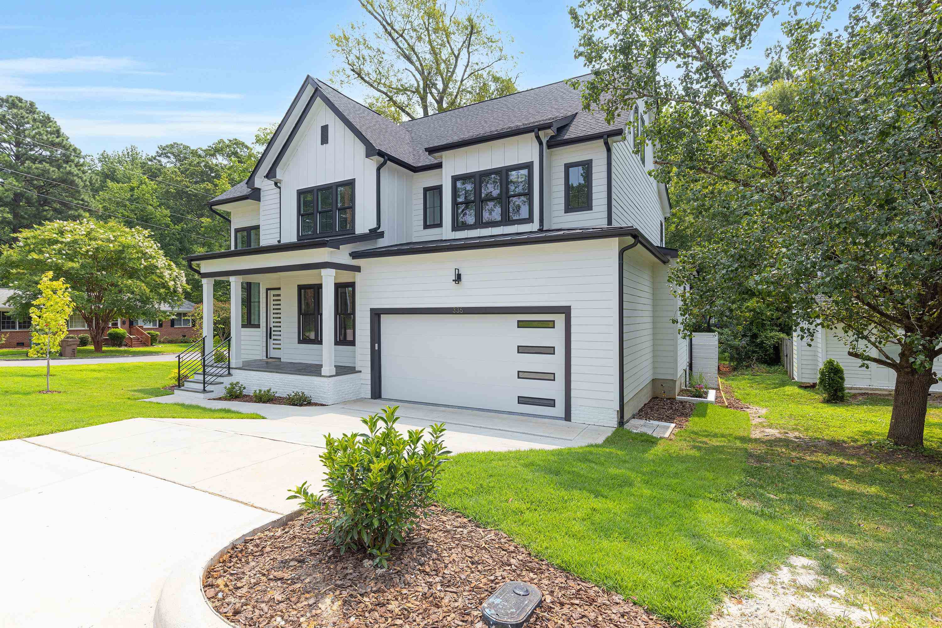 336 Waldo Street Cary, NC 27511 - Photo 2 of 62 a front view of a house with garden