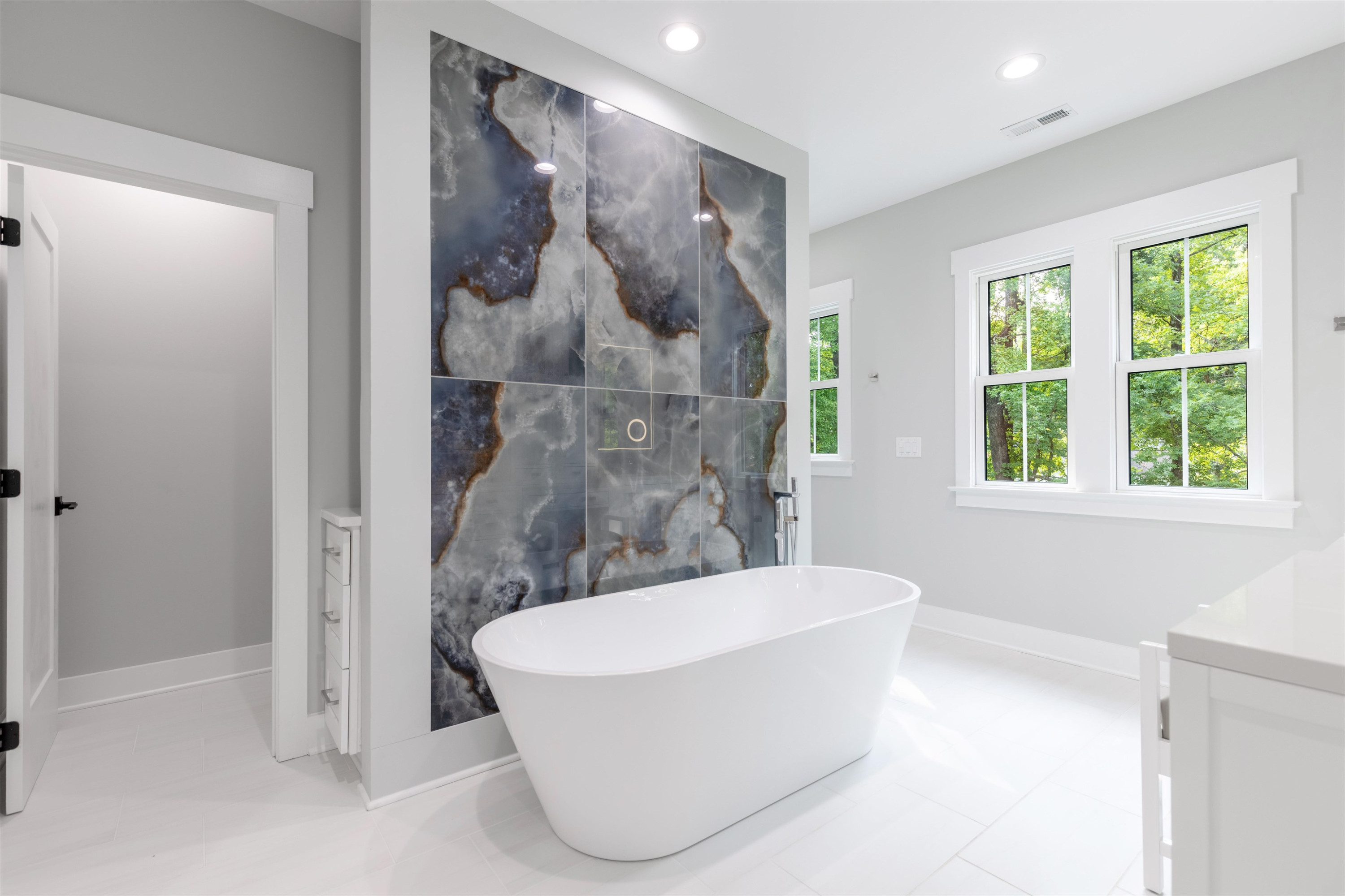 336 Waldo Street Cary, NC 27511 - Photo 27 of 62 a bathroom with a bathtub and window