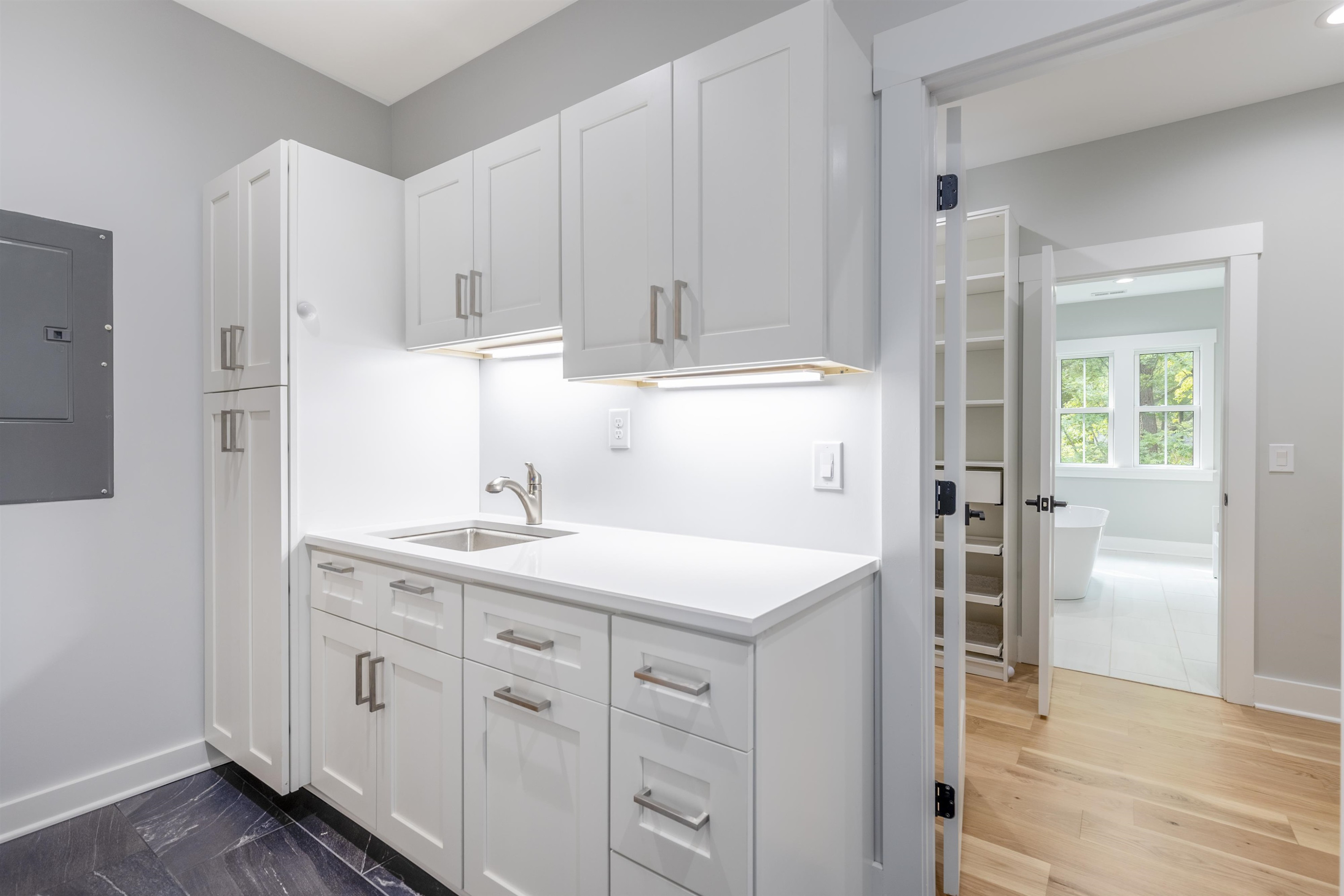 336 Waldo Street Cary, NC 27511 - Photo 30 of 62 a kitchen with white cabinets and sink
