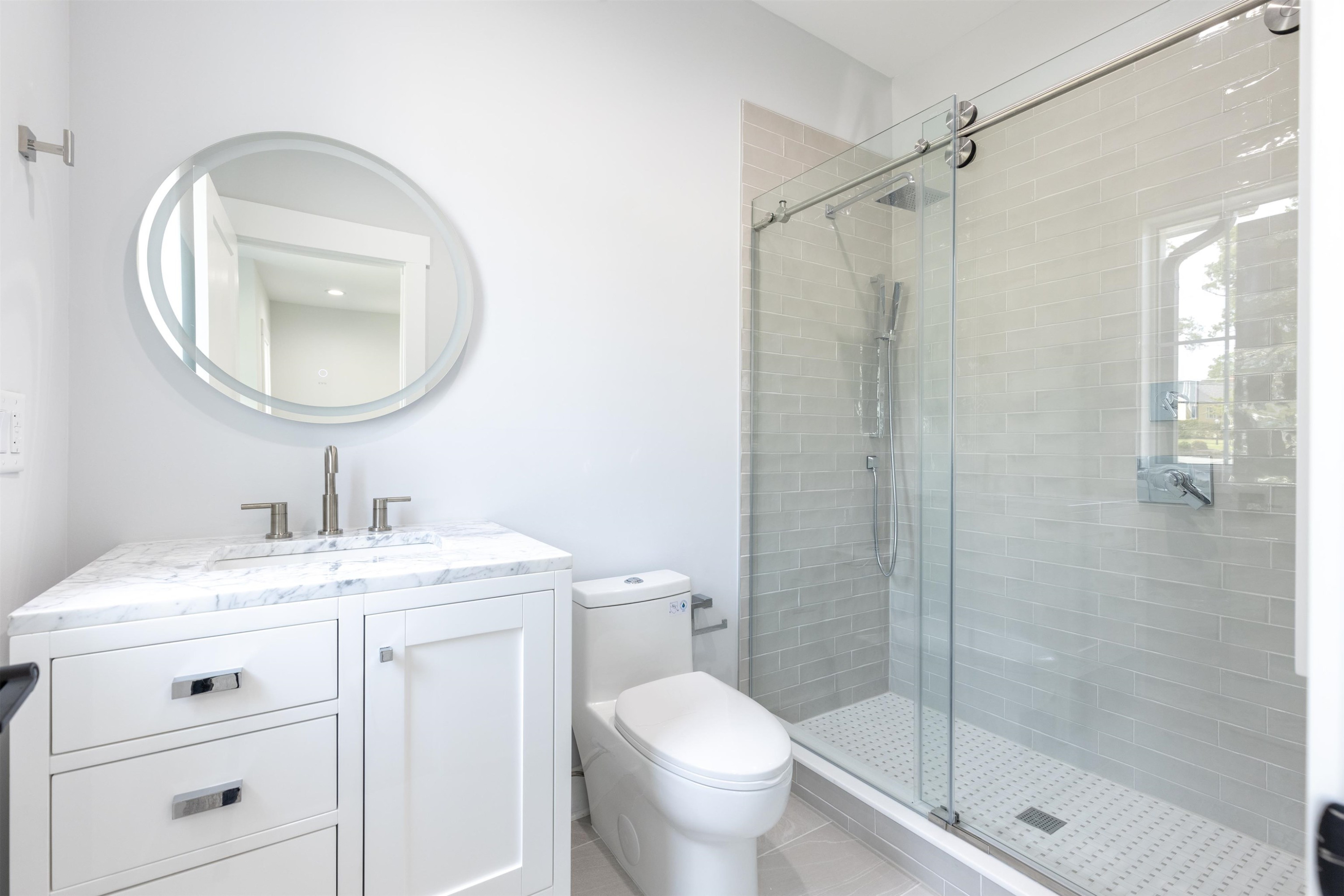 336 Waldo Street Cary, NC 27511 - Photo 31 of 62 a bathroom with a granite countertop sink toilet and a mirror