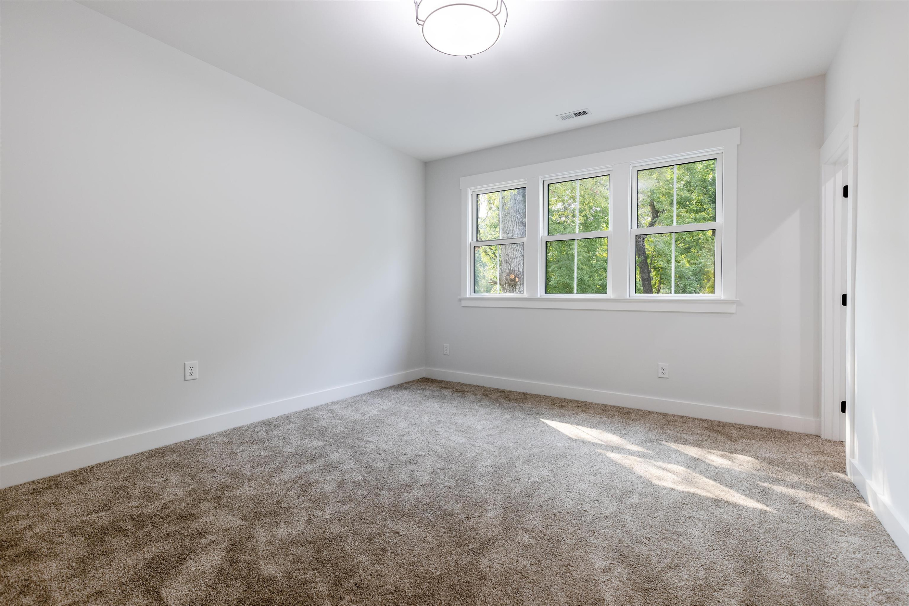 336 Waldo Street Cary, NC 27511 - Photo 33 of 62 an empty room with a window