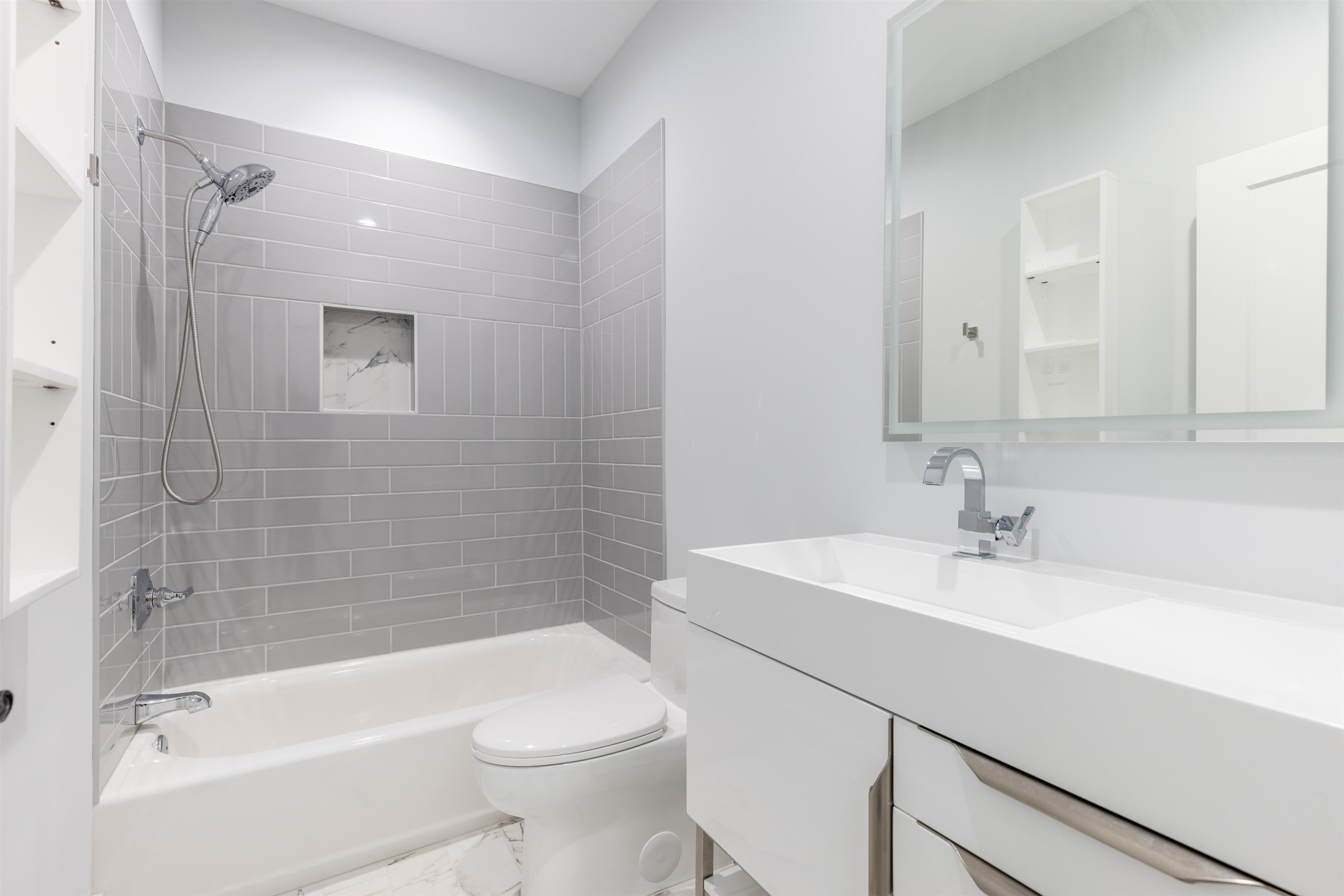 336 Waldo Street Cary, NC 27511 - Photo 37 of 62 a bathroom with a sink a toilet and shower