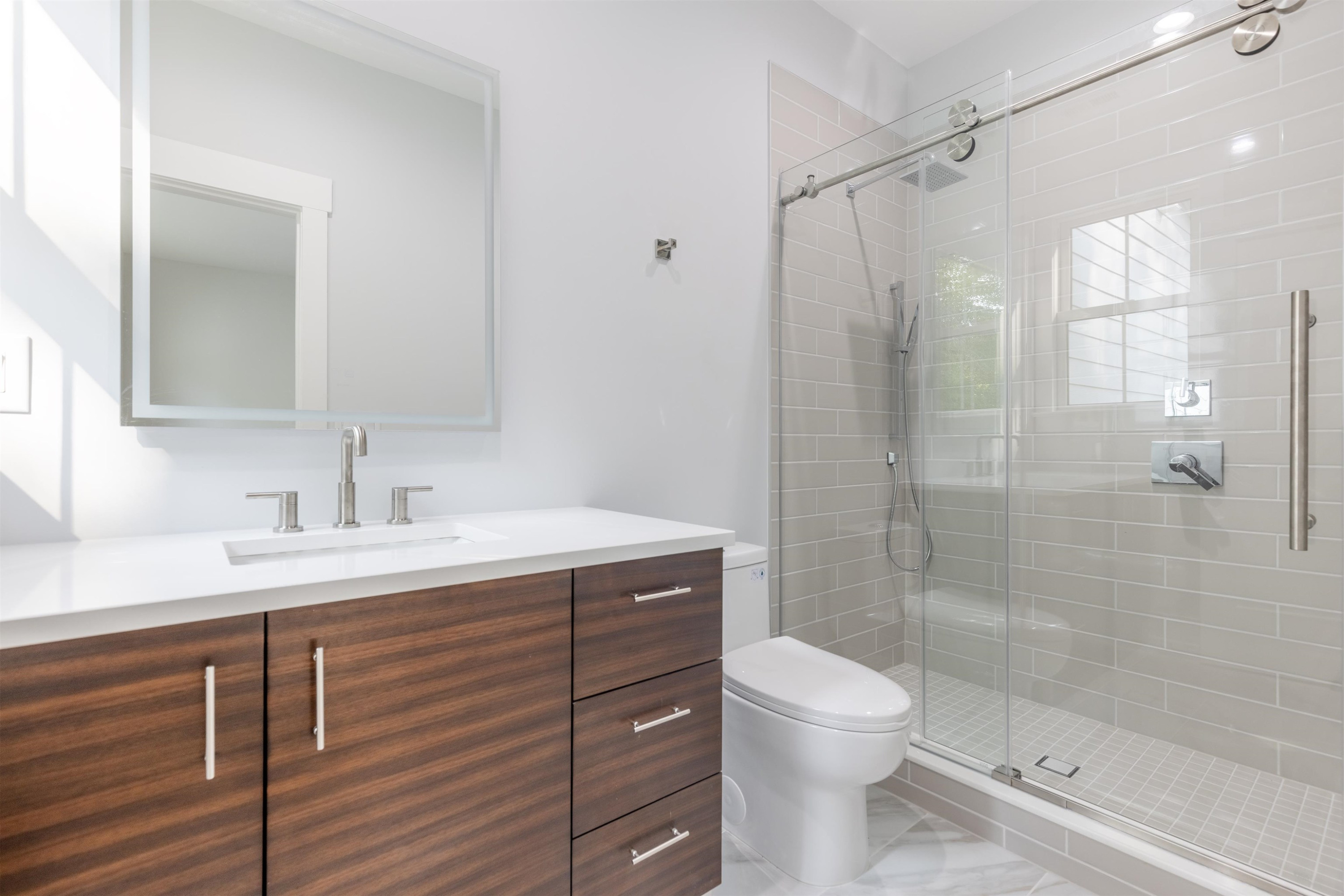 336 Waldo Street Cary, NC 27511 - Photo 39 of 62 a bathroom with a sink toilet and shower