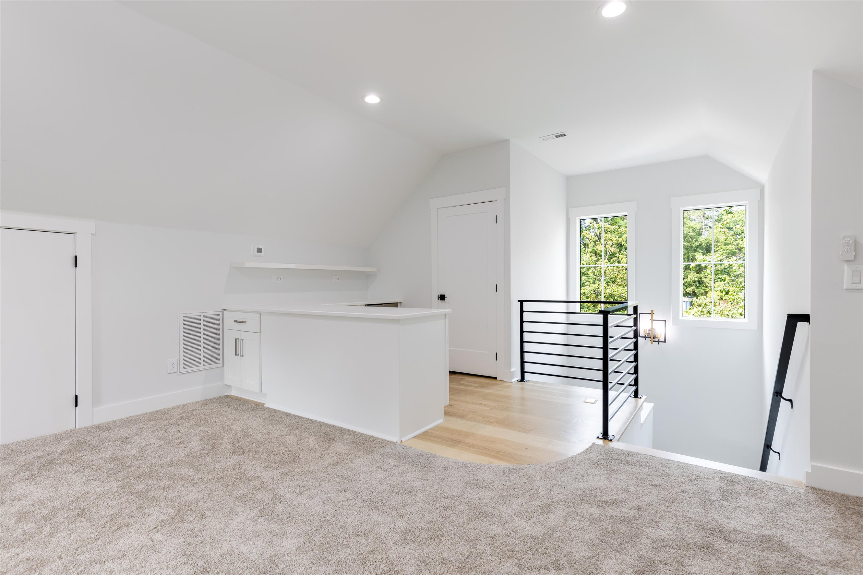 336 Waldo Street Cary, NC 27511 - Photo 41 of 62 a view of empty room with wooden floor and fan
