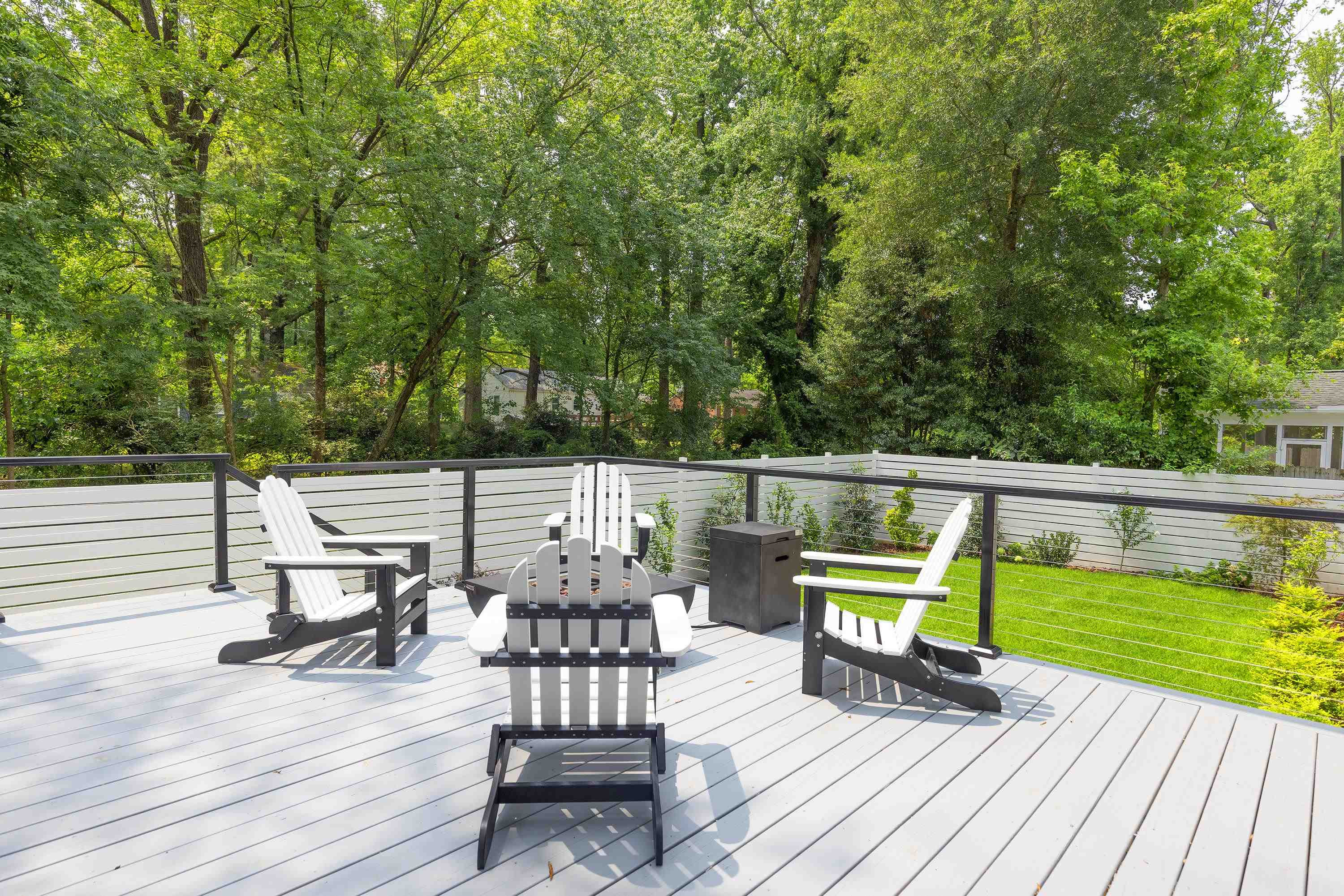 336 Waldo Street Cary, NC 27511 - Photo 48 of 62 a view of a deck with chairs a barbeque with wooden floor and fence