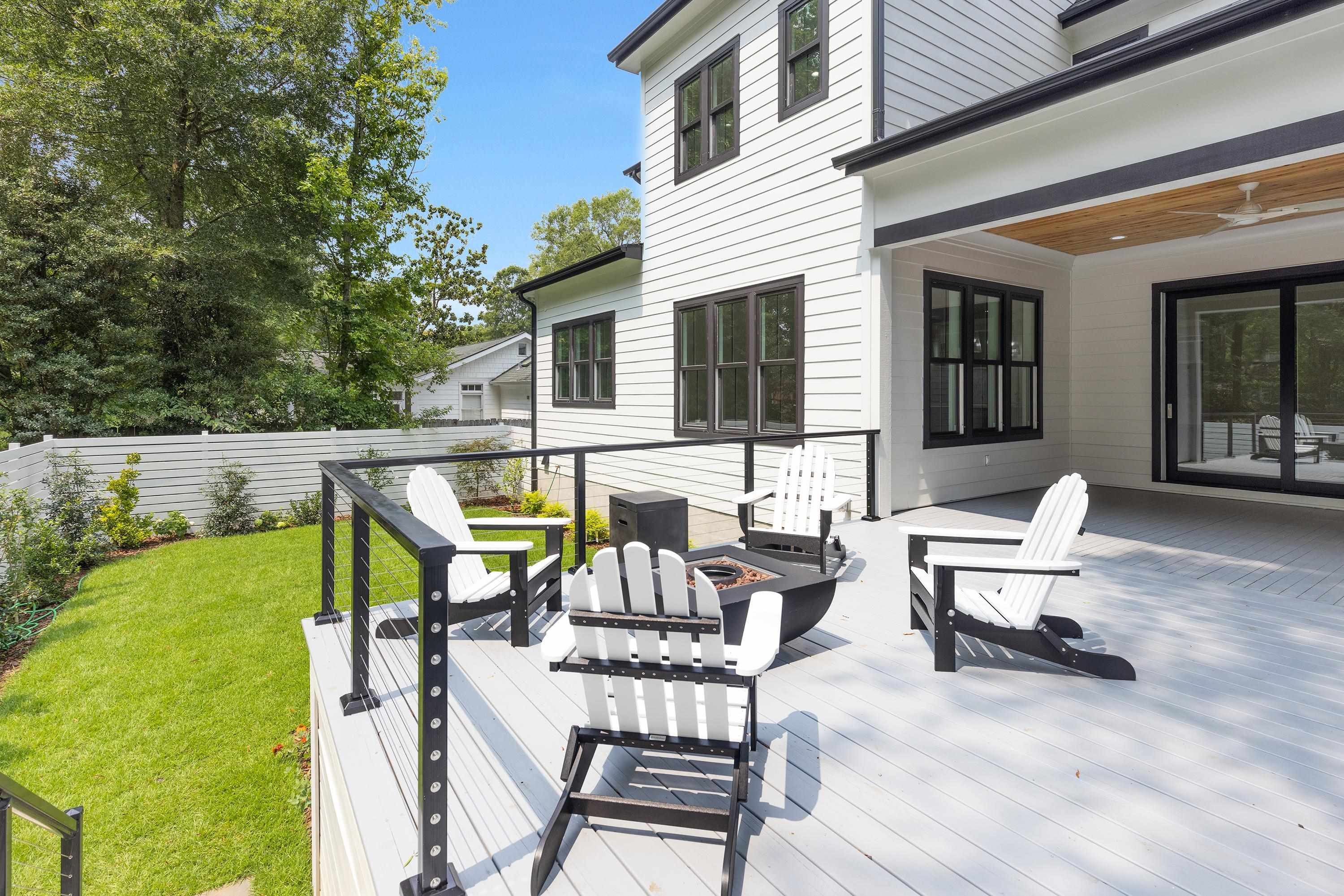 336 Waldo Street Cary, NC 27511 - Photo 49 of 62 a view of a patio with table and chairs next to a yard