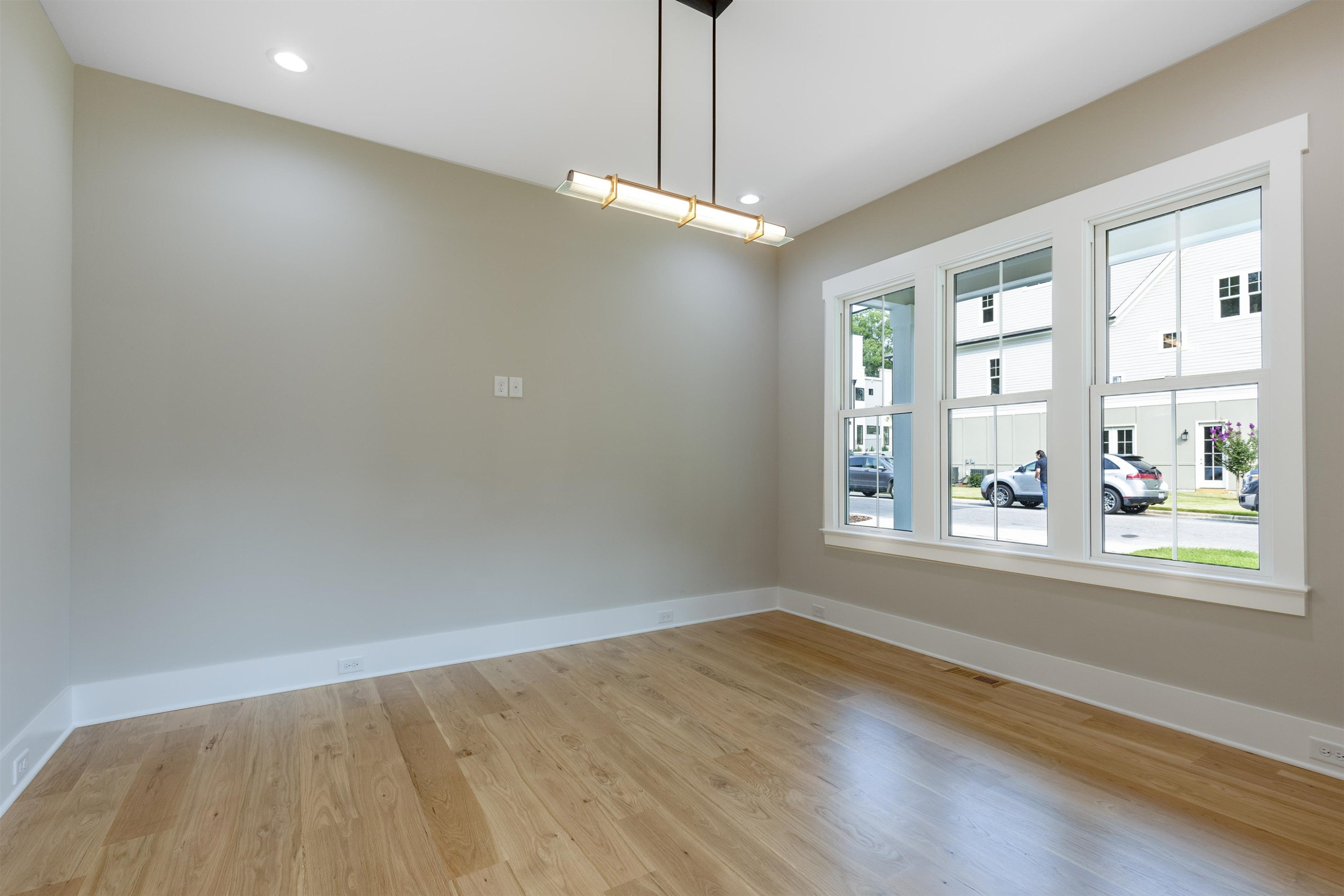 336 Waldo Street Cary, NC 27511 - Photo 6 of 62 wooden floor in an empty room with a window
