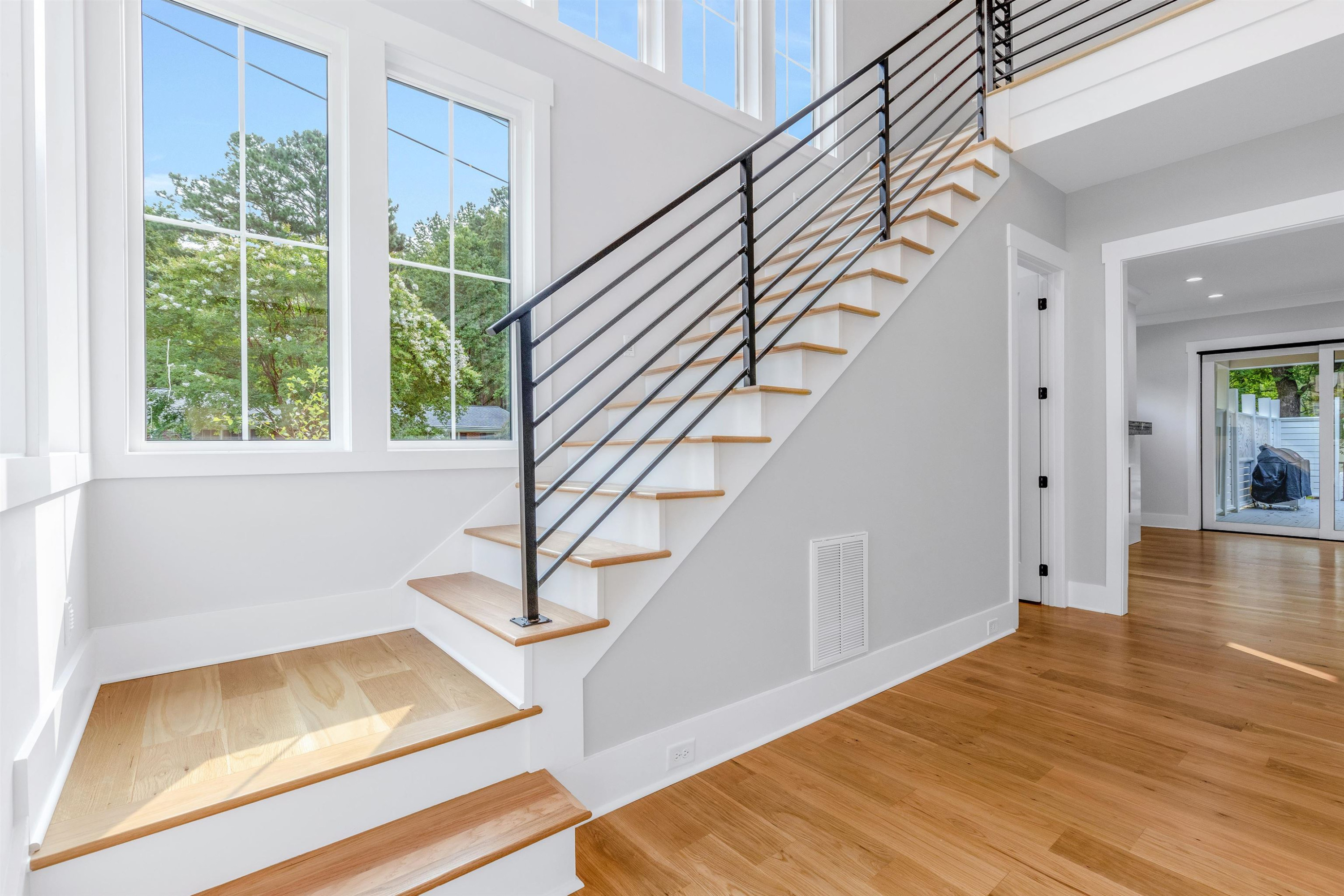 336 Waldo Street Cary, NC 27511 - Photo 8 of 62 a view of entryway and hall with wooden floor