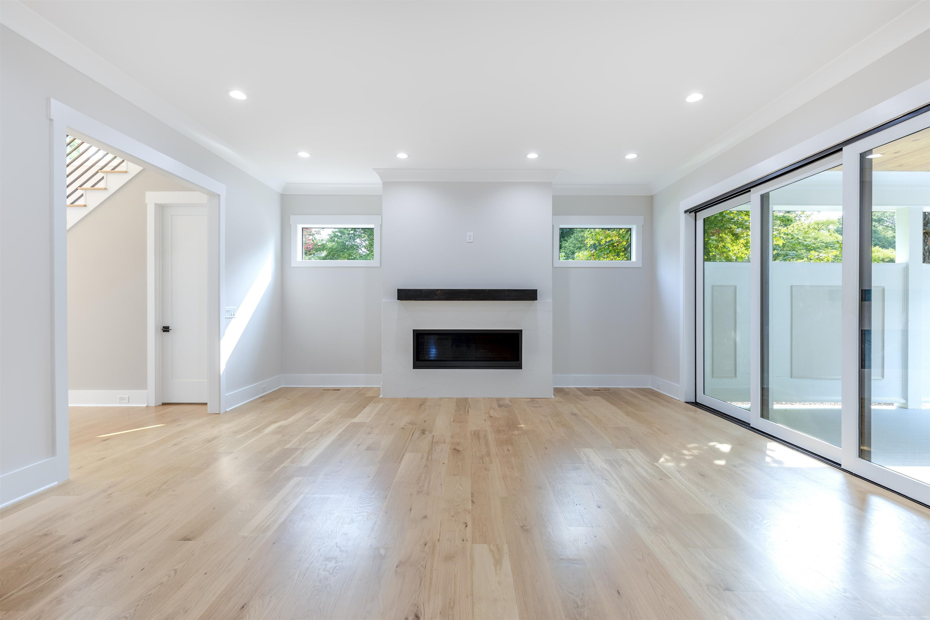 336 Waldo Street Cary, NC 27511 - Photo 10 of 62 a view of an empty room with a fireplace and a window