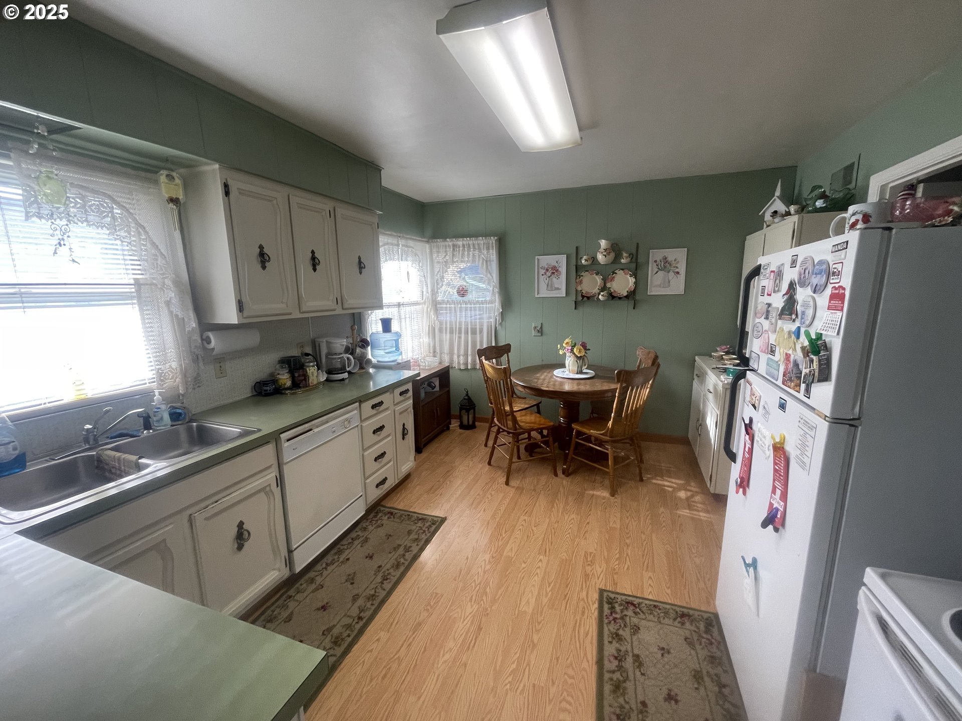 615 South E Hager Street Heppner, OR 97836 - Photo 12 of 14 a kitchen with stainless steel appliances a white cabinets and a window