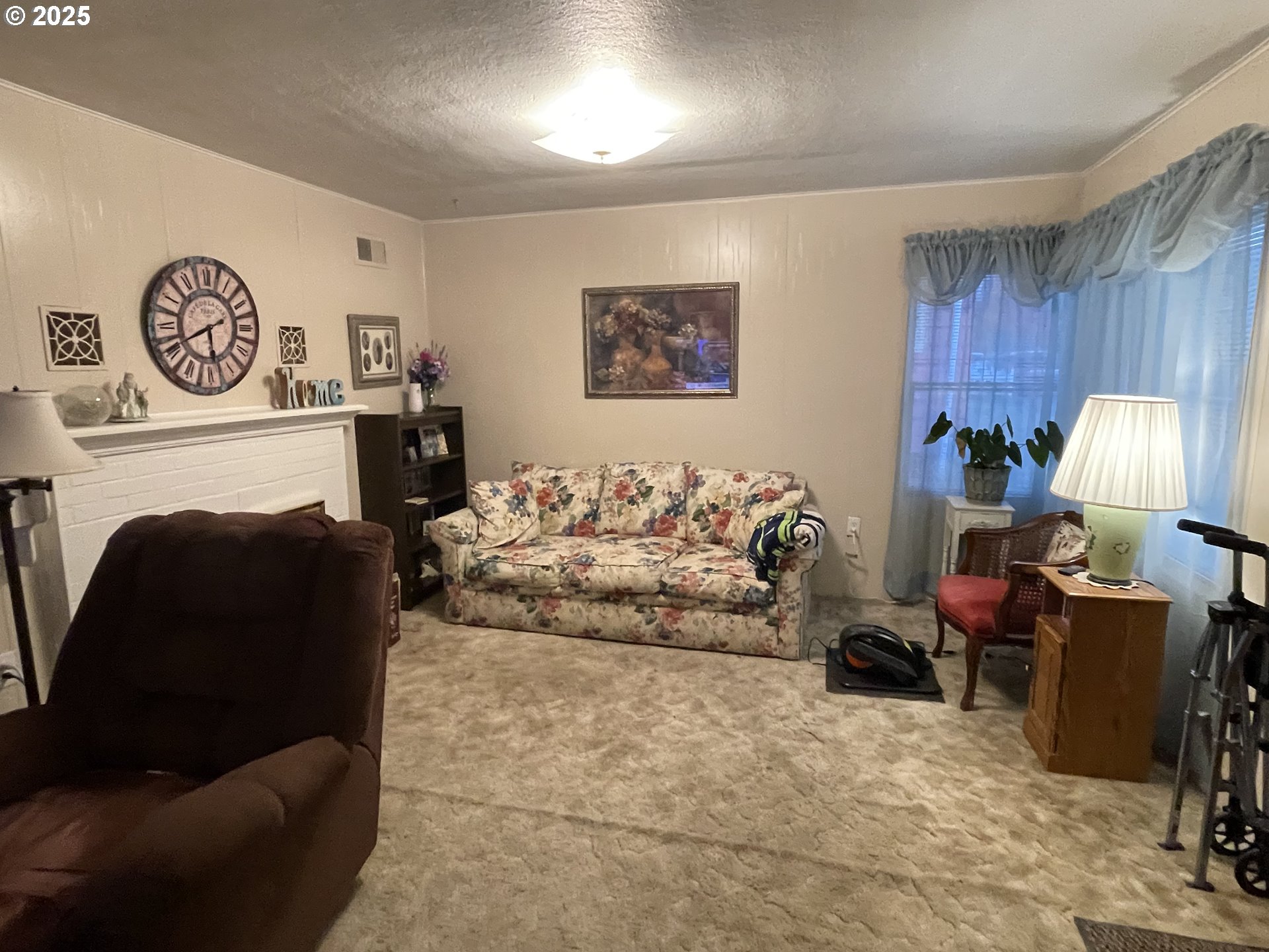 615 South E Hager Street Heppner, OR 97836 - Photo 2 of 14 a living room with furniture and a fireplace