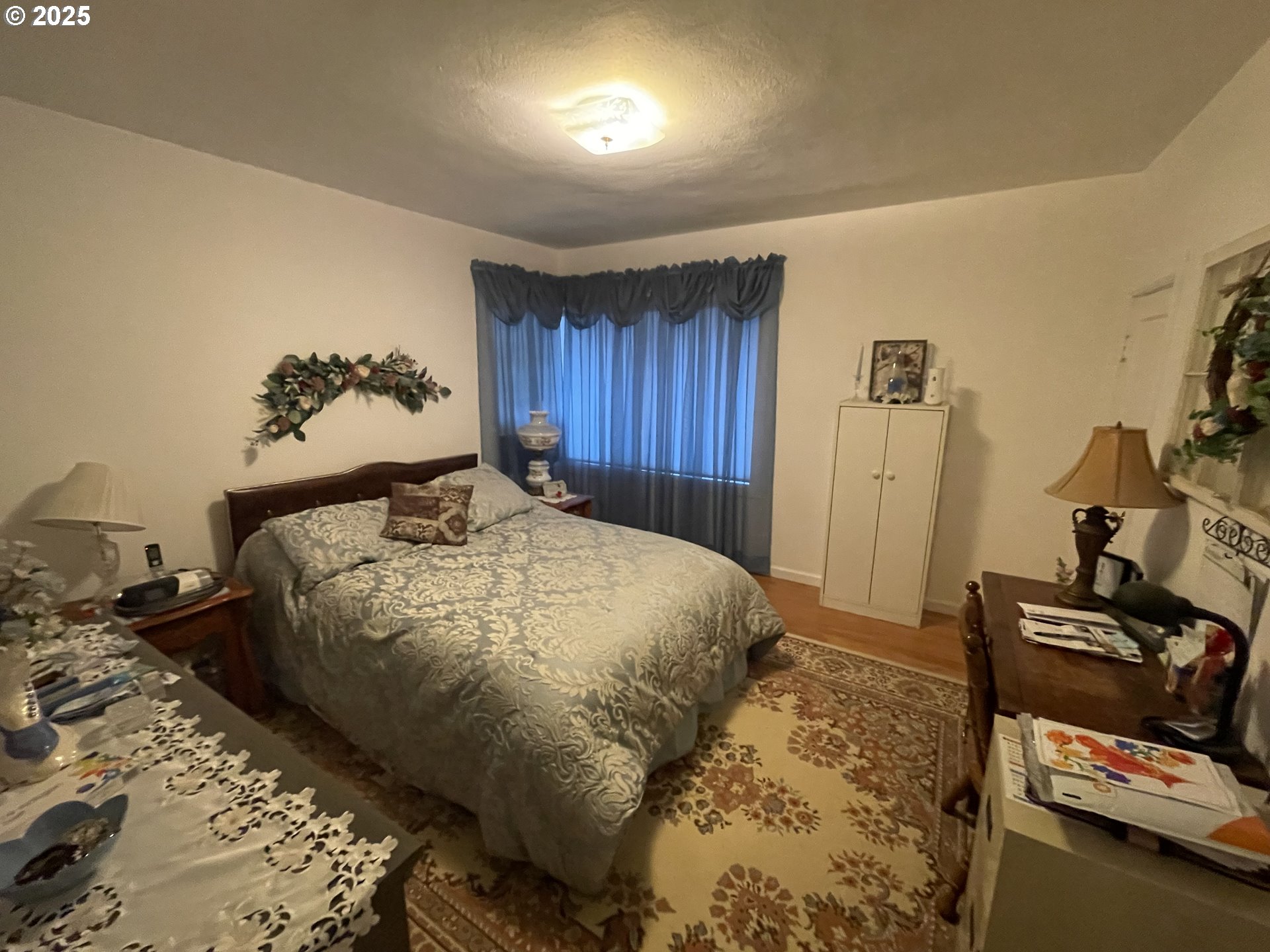 615 South E Hager Street Heppner, OR 97836 - Photo 5 of 14 a bedroom with a bed and wooden floor