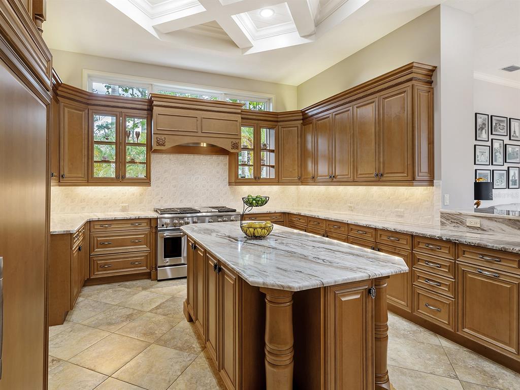 19428 Ganton Avenue Lakewood Ranch, FL 34202 - Photo 27 of 96 a kitchen with granite countertop a sink and a stove