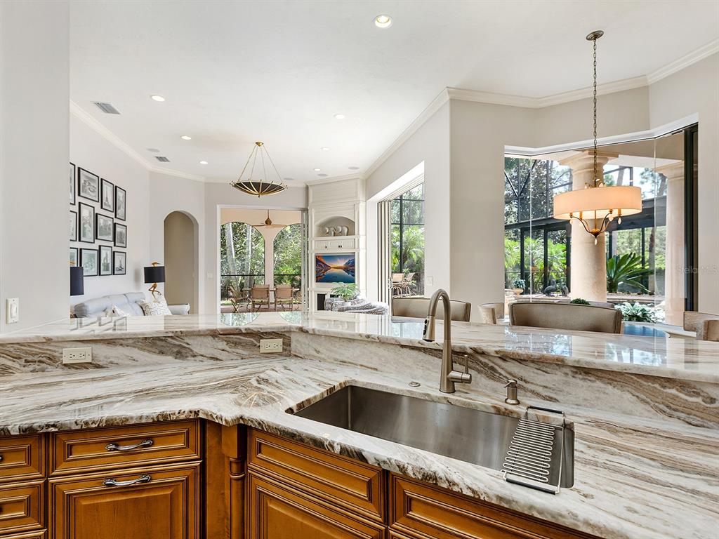 19428 Ganton Avenue Lakewood Ranch, FL 34202 - Photo 29 of 96 a kitchen with granite countertop a sink and a window