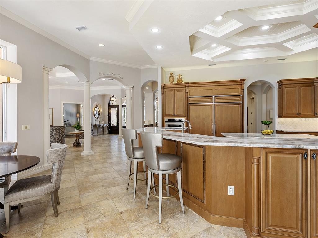 19428 Ganton Avenue Lakewood Ranch, FL 34202 - Photo 31 of 96 a large kitchen with a table and chairs