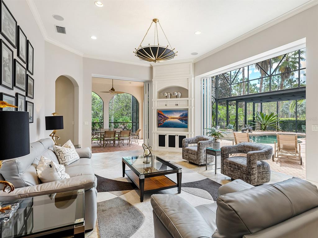 19428 Ganton Avenue Lakewood Ranch, FL 34202 - Photo 33 of 96 a living room with furniture and a large window