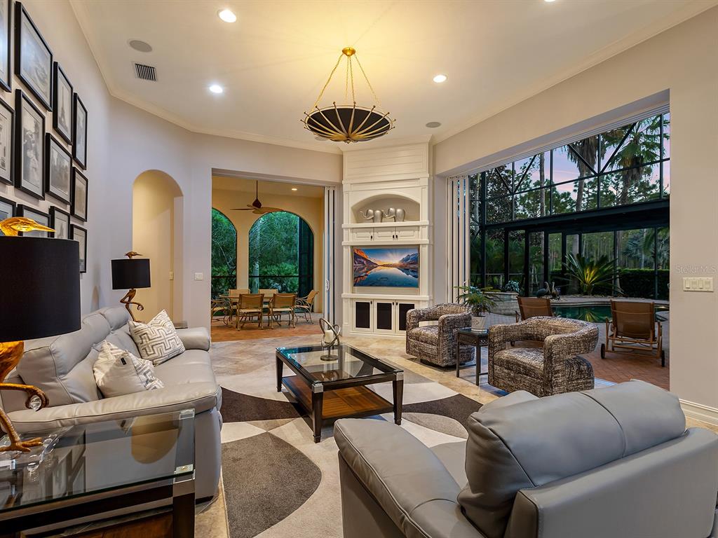 19428 Ganton Avenue Lakewood Ranch, FL 34202 - Photo 37 of 96 a living room with furniture large window and outer view
