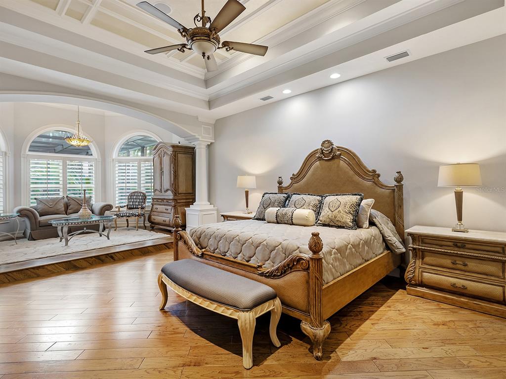 19428 Ganton Avenue Lakewood Ranch, FL 34202 - Photo 40 of 96 a spacious bedroom with a bed and a large window