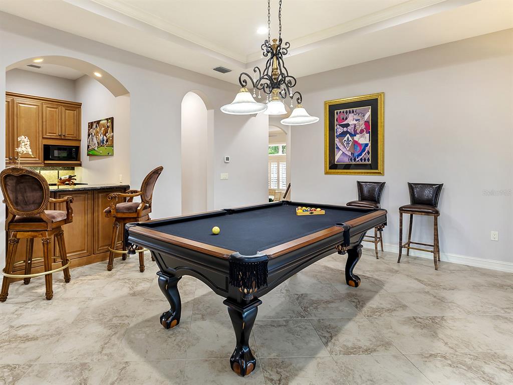 19428 Ganton Avenue Lakewood Ranch, FL 34202 - Photo 56 of 96 a room with pool table and windows