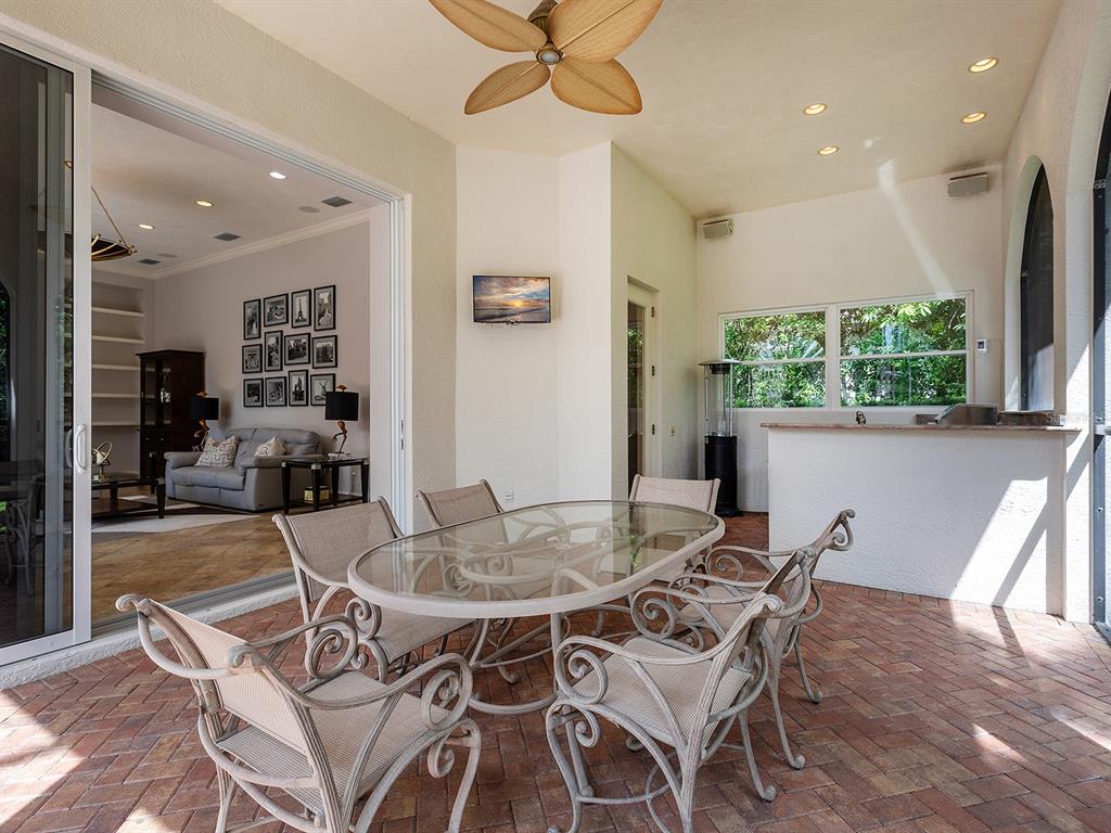 19428 Ganton Avenue Lakewood Ranch, FL 34202 - Photo 76 of 96 a dining room with furniture and window