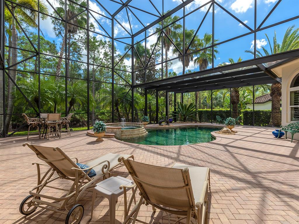 19428 Ganton Avenue Lakewood Ranch, FL 34202 - Photo 77 of 96 a view of a patio with a table chairs and a backyard
