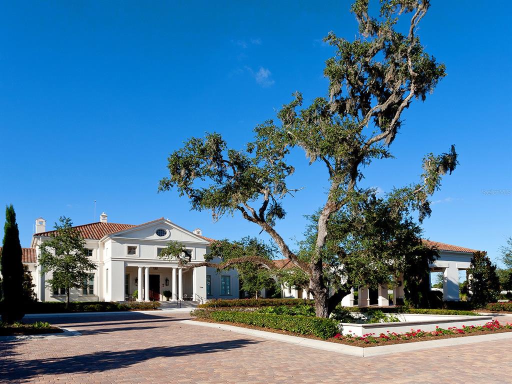 19428 Ganton Avenue Lakewood Ranch, FL 34202 - Photo 91 of 96 a front view of a house with a yard