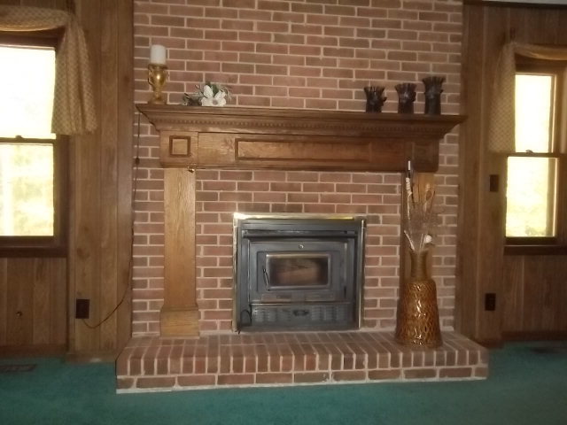 236 Plantation Road Gray, GA 31032 - Photo 6 of 26 a view of fireplace with wooden floor