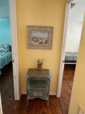 a bedroom with a bed and a chair