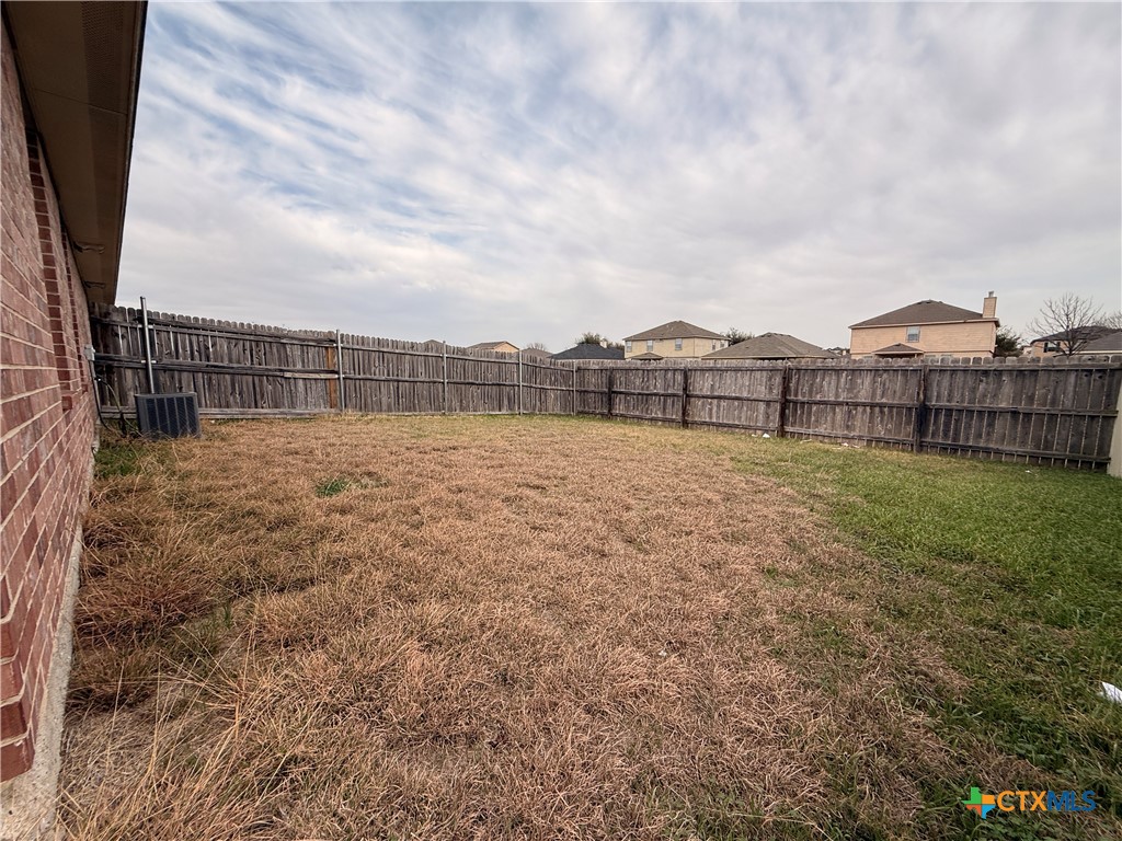 6210 Temora Loop, Unit B Killeen, TX 76549 - Photo 11 of 11 a view of a pathway with a wrought fence