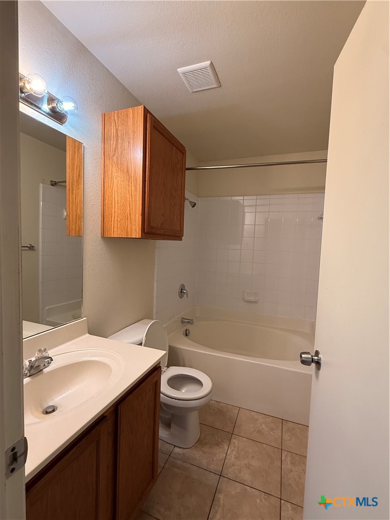 6210 Temora Loop, Unit B Killeen, TX 76549 - Photo 9 of 11 a bathroom with a sink a toilet and shower