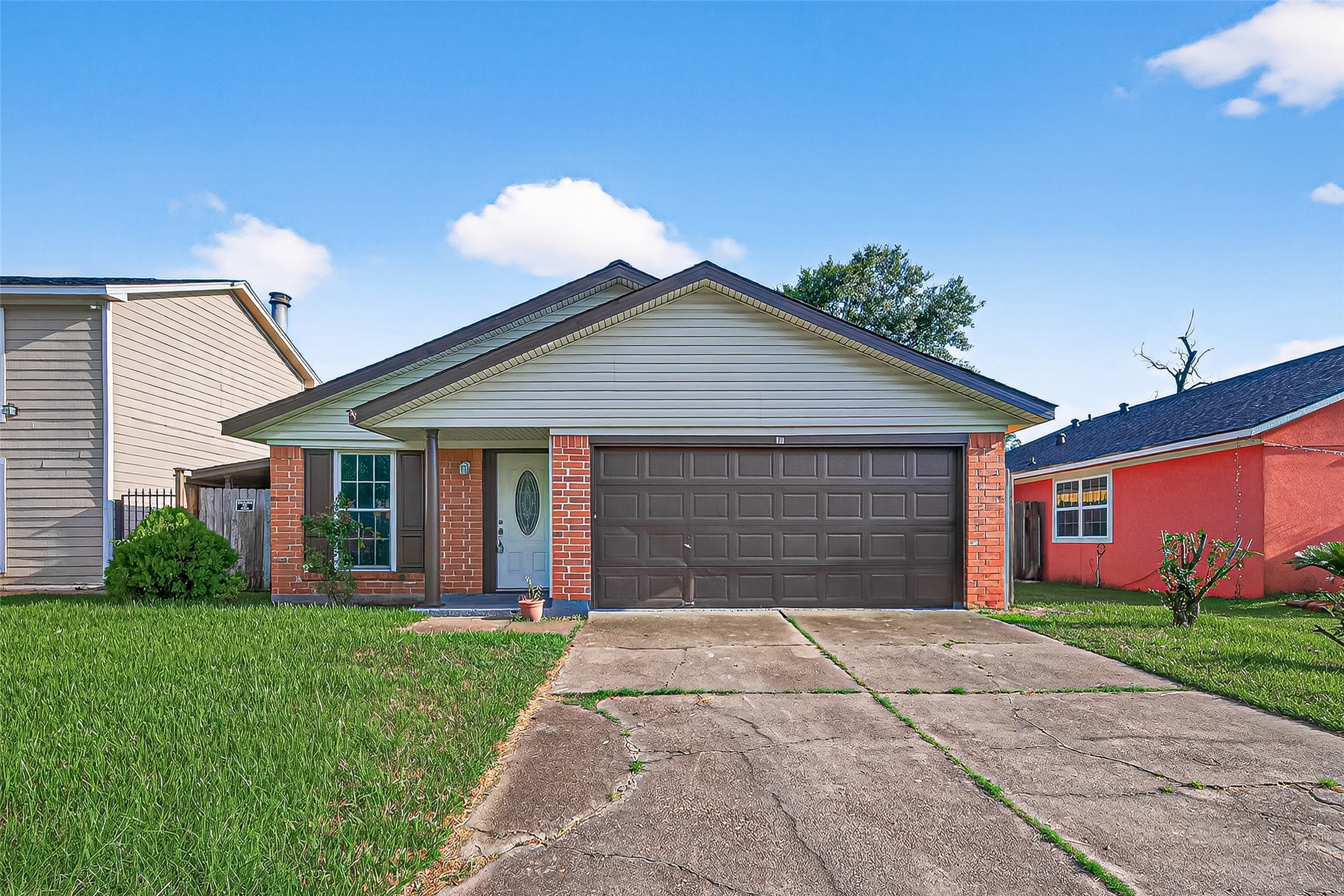 a front view of house with yard and green space