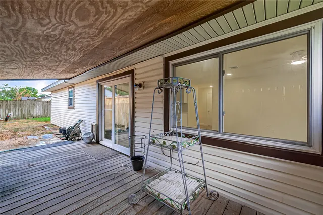 a view of a balcony with chairs
